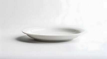 Empty white ceramic round plate isolated on white background. 