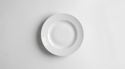 Empty white ceramic round plate isolated on white background. 