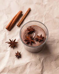 Christmas composition soy wax handmade candles in glass jars, soy candles decorated with star anise, cinnamon and dried oranges. Home therapy and relaxing concept. Scented candle, aesthehic product