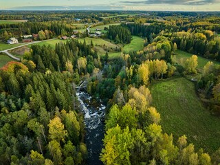 Aerial view of autumn countryside with river.