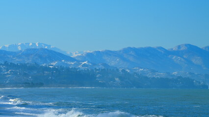 Large Body Of Water With Mountains In The Background. Most Beautiful Beaches In The World. Real time.