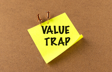 Value trap concept with a sticky note pinned to a corkboard 