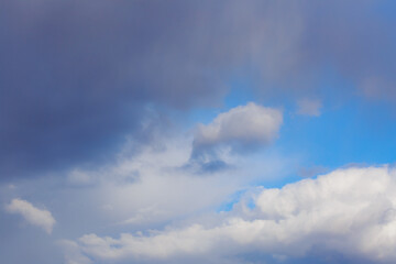 White heap clouds in the blue peaceful sky. The concept of psychological calmness and health. Peace of mind with the forces of nature. Air travel concept.