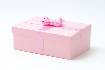 Fototapeta premium A pastel pink gift box with delicate bow on solid white background, single object