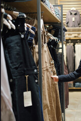 Stylish Apparel Display in Modern Clothing Store Featuring Versatile Overalls