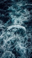 Fototapeta premium Powerful Waves: Aerial Capture of Dark Ocean Waves Crashing Against the Shore