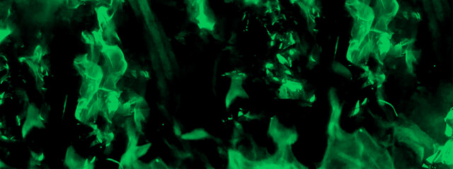 Abstract blue fire in dark background. Grunge texture black and blue color background. Festive New Year grunge background with Flowering design.	

