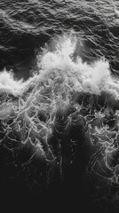 Raw Power: Aerial Capture of Dark Ocean Waves and White Foam in Dramatic Contrast