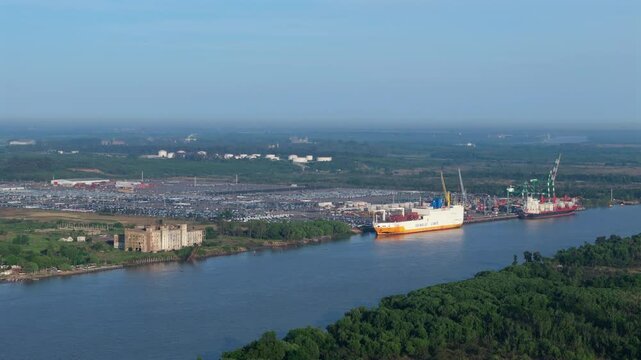 Wide aerial view of cargo terminal in Puerto de Zarate, importing cars. Buenos Aires, Argentina.