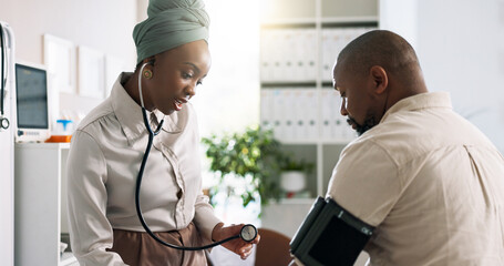 Doctor, black woman and blood pressure in consultation with patient and hypertension check in clinic. Healthcare, consultant and medical professional with stethoscope and cardiology for wellness