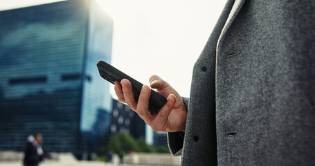 Message, outdoor and hand with smartphone, city and networking with contact, corporate and typing. Browsing, tech and person with mobile, communication and texting for business, legal and lawyer