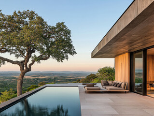 Fototapeta premium Modern villa with infinity pool and scenic views during sunset in the countryside