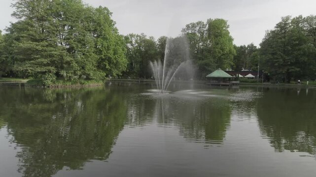 Pond with fountain orbit 4k drone footage Dlog 10 Bit ungraded