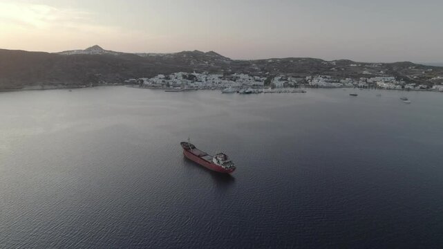 Cargo ship in front of Milos port 4k drone footage Dlog 10 Bit ungraded