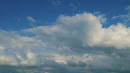 Fototapeta premium Abstract Cumulus Clouds. Beautiful Clouds Move On A Warm Summer Day. For Eco Or Weather Climate Projects.