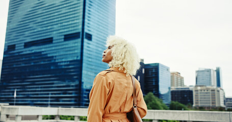 Back view, sightseeing or woman in city with urban fashion or trendy coat outside in New York....