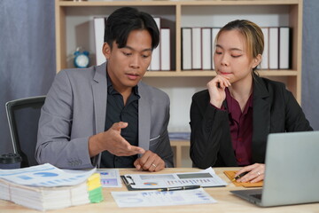 Financial Analysis: Business team working in office with tablets and documents to plan and analyze financial reports discussing investments according to business plan.