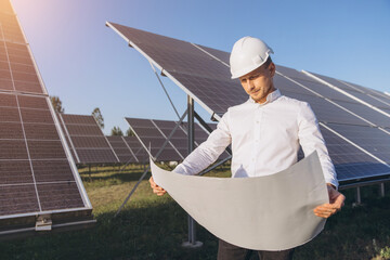 Engineer Inspecting Solar Panels at a Renewable Energy Site