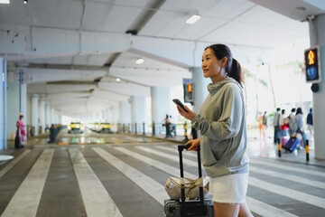 Stylish Traveler Navigating a Bustling Airport Terminal with Luggage