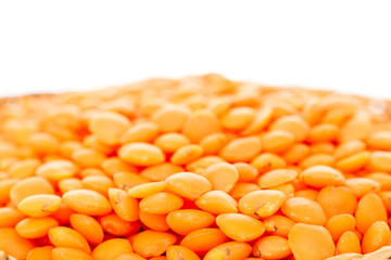 Raw red lentils , macro, isolated on white background.