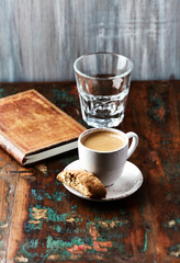 Cup of coffee and Cantuccini (Italian cookie) on dark wooden background. Copy space.