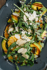 Salad with avocado, rocket and orange