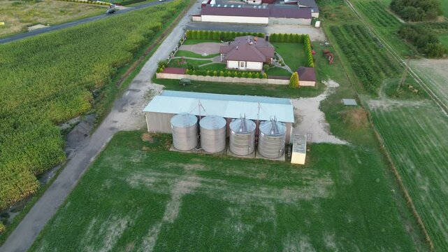 Rural farm buildings and silos from above