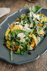 Salad with avocado, rocket and orange