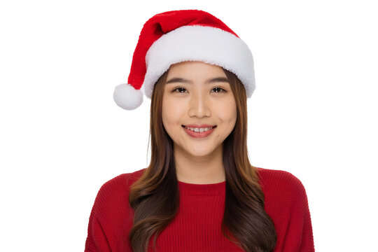 portrait of a smiling woman wearing santa hat