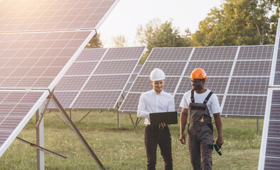 Engineers Discuss Solar Panel Efficiency at Renewable Energy Site