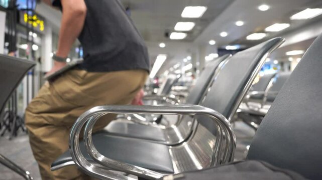 soft focus business concept with asian man sit on chair and work with tablet in airport 