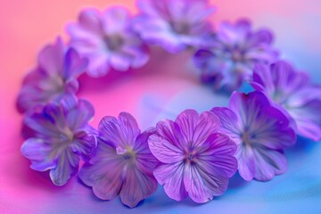 Obraz premium Defocused purple flowers arranged in circle on multicolored backdrop flowers