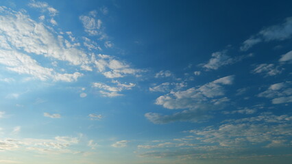 Blue heaven summer cloudscape. Rolling puffy white clouds are moving. Time lapse.