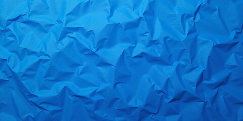 Obraz premium Crinkled Paper Texture Background In Sapphire Color
