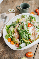 Parma ham salad served in a white plate