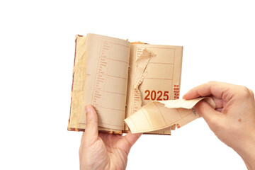 2025 man hands pulling out  page from notebook close-up