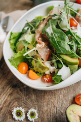 Parma ham salad served in a white plate