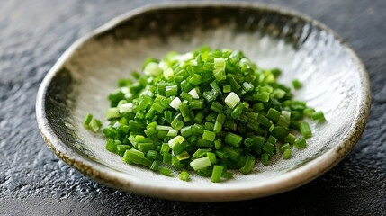 Finely chopped green onions served on an elegant plate