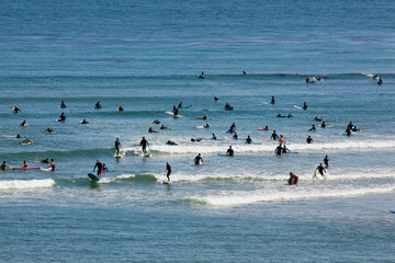 Surfers riding the waves on Steamer Lane, Santa Cruz, CA.