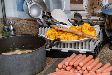 Fried plantains and sausages, Colombian food preparation. Easy to make food. Home.
