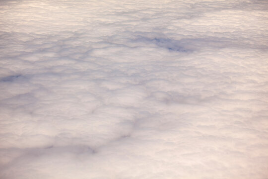 Mid Air view of cloud cover from an aircraft over the  Pacific Ocean.