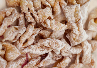 Angel wings (Faworki), cakes. Sweet pastry deep fried and sprinkled with powdered sugar