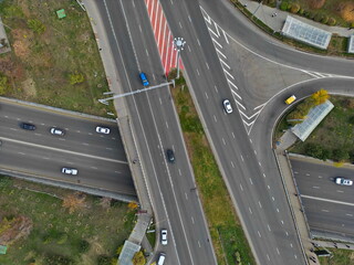 Traffic on one of the main streets. A road junction. The view from the drone.