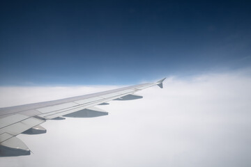 The airplane flew over the clouds.	