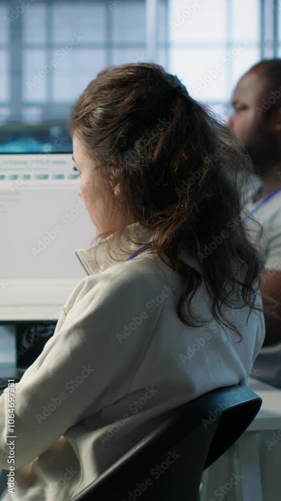 Poster system admin working in diverse computer network security data center workplace, ensuring optimal pe