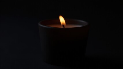 Black glass candle holder with smooth lines, perfect for a simple and elegant ambiance