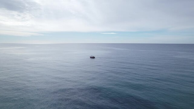 View of a boat alone in the open Mediterranean Sea