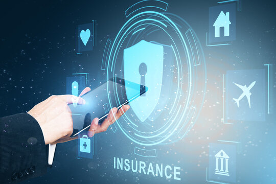 Close up of businessman hand using tablet with creative life insurance hologram with padlock and other icons on blue background. - Powered by Adobe