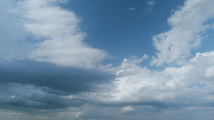 Obraz premium Beautiful dark dramatic sky with stormy clouds before rain or snow. Thunderstorm heaven landscape. Timelapse.
