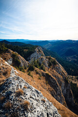 White limestone rocks overlooking scenic apuseni mountains in romania